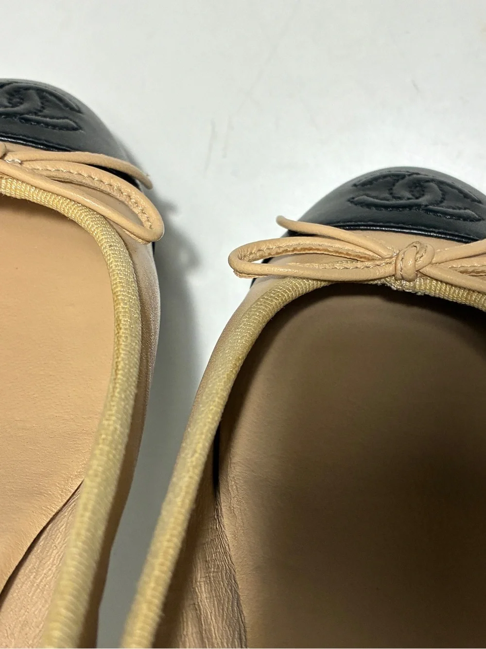 CHANEL Two-Tone Beige and Black Cap-Toe Ballet Flats